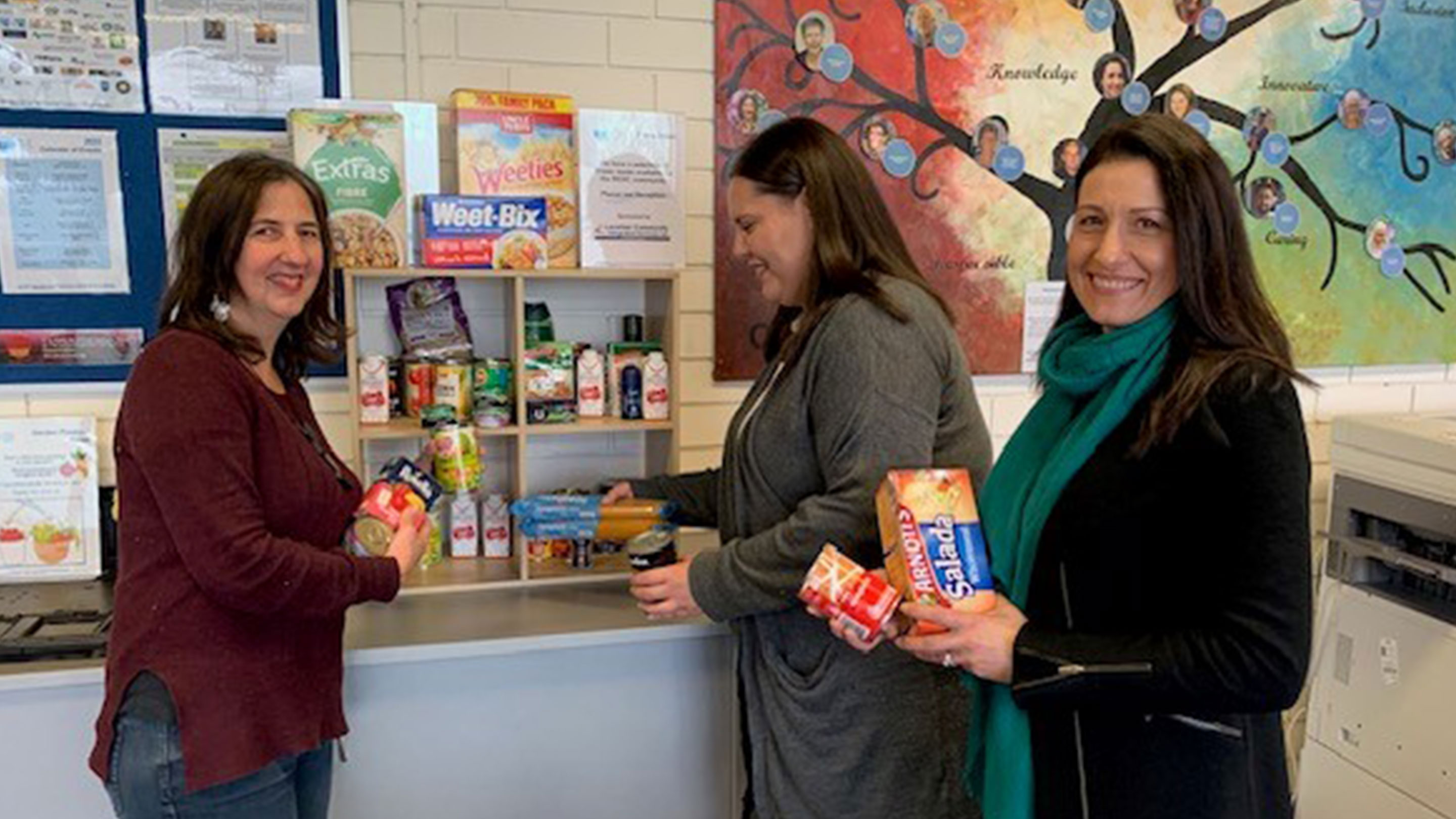 Image Mobil is proud to support the pantry swap project at the Williamstown Community and Education Centre, pictured here are some of the Centres staff contributing to the display stock.