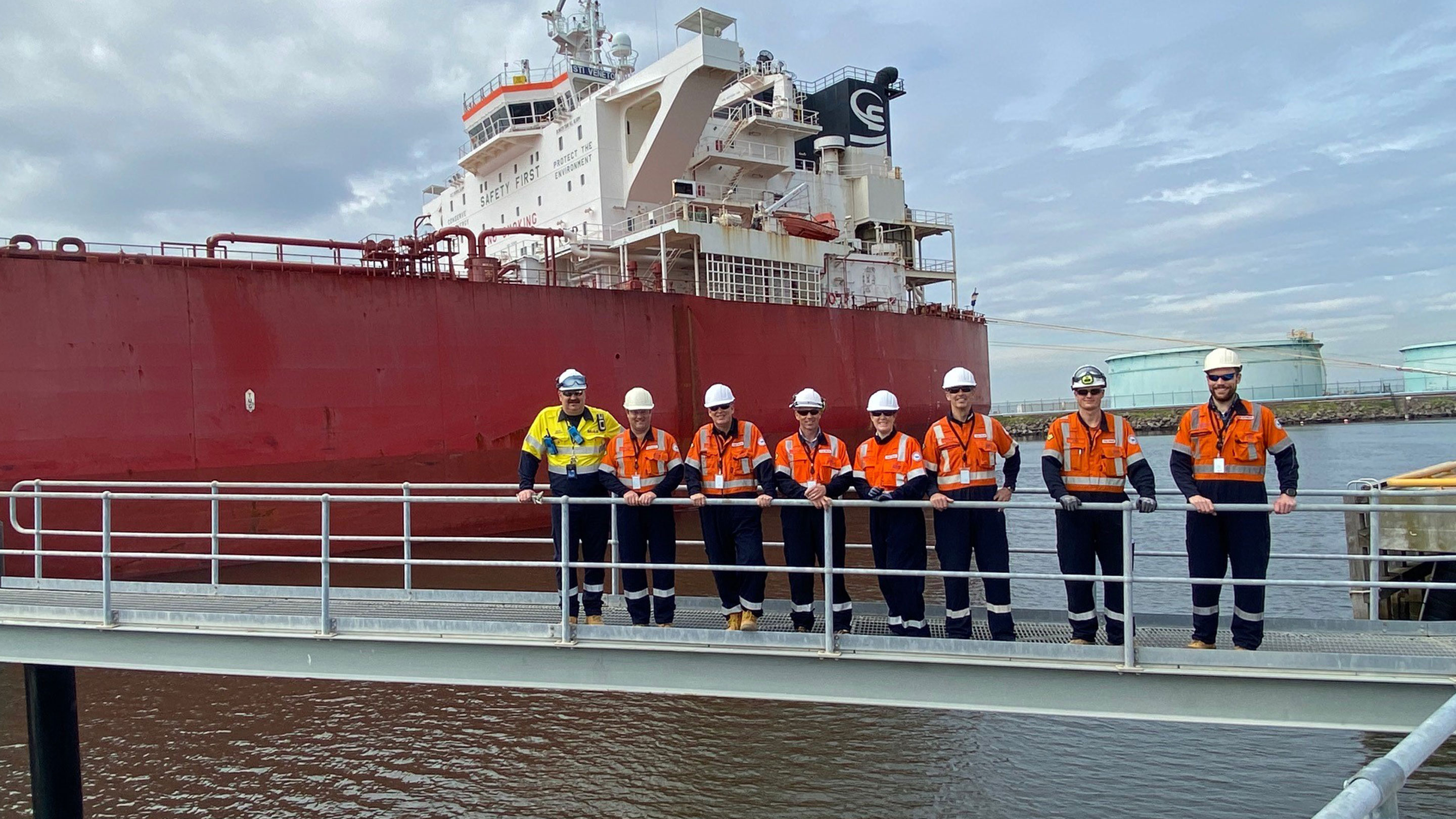 Image The team celebrating the first Long Range vessel docking at Gellibrand Wharf.